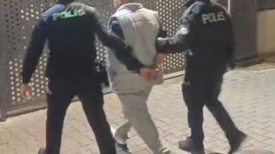İzmir'in Konak ilçesinde polis, 16 yıl hapis cezası bulunan O.B.