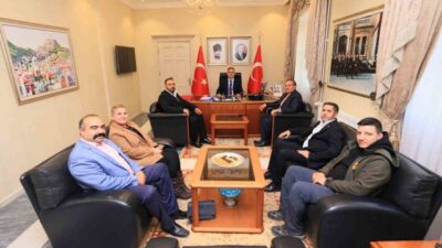 Muğla'da TSYD tarafından düzenlenen programda Kemal Çağlayan ve ilçe temsilcileri,